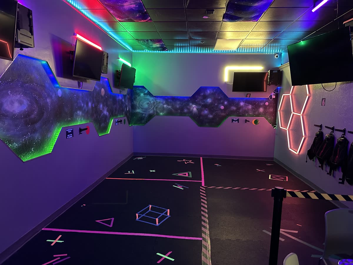 Wide angle view of a spacious virtual reality lounge with multiple VR stations